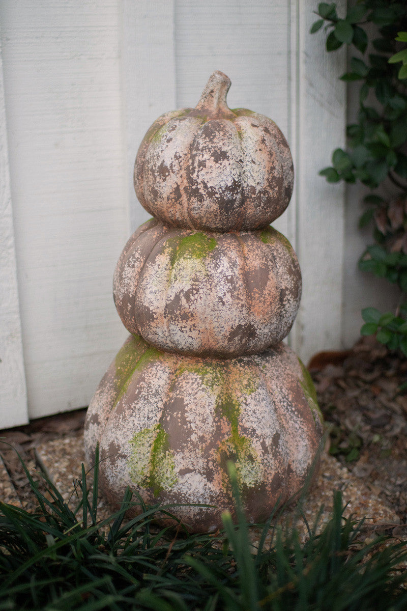 There Stacked Concrete Pumpkins